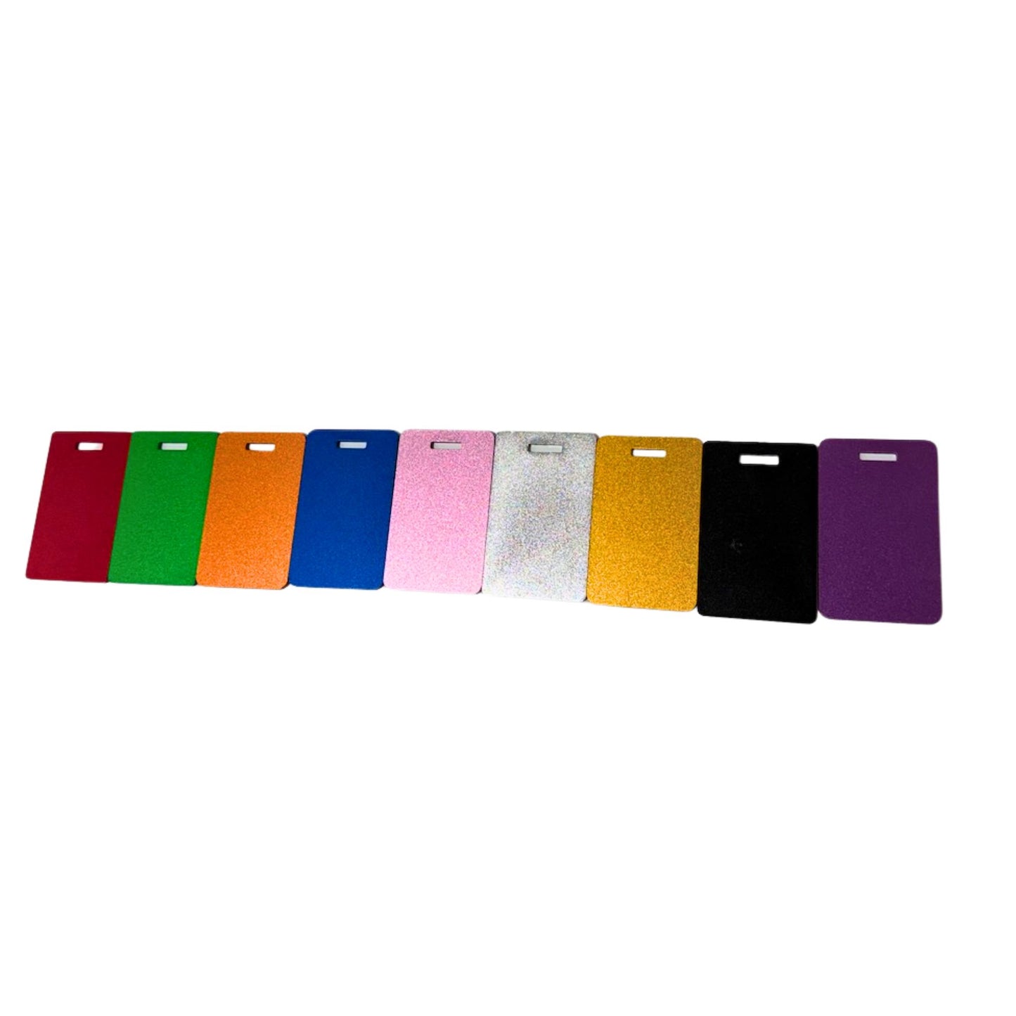 A row of nine rectangular card-like Luggage Tags in assorted colors, including red, green, orange, blue, pink, silver, gold, black, and purple, arranged horizontally on a plain white background.