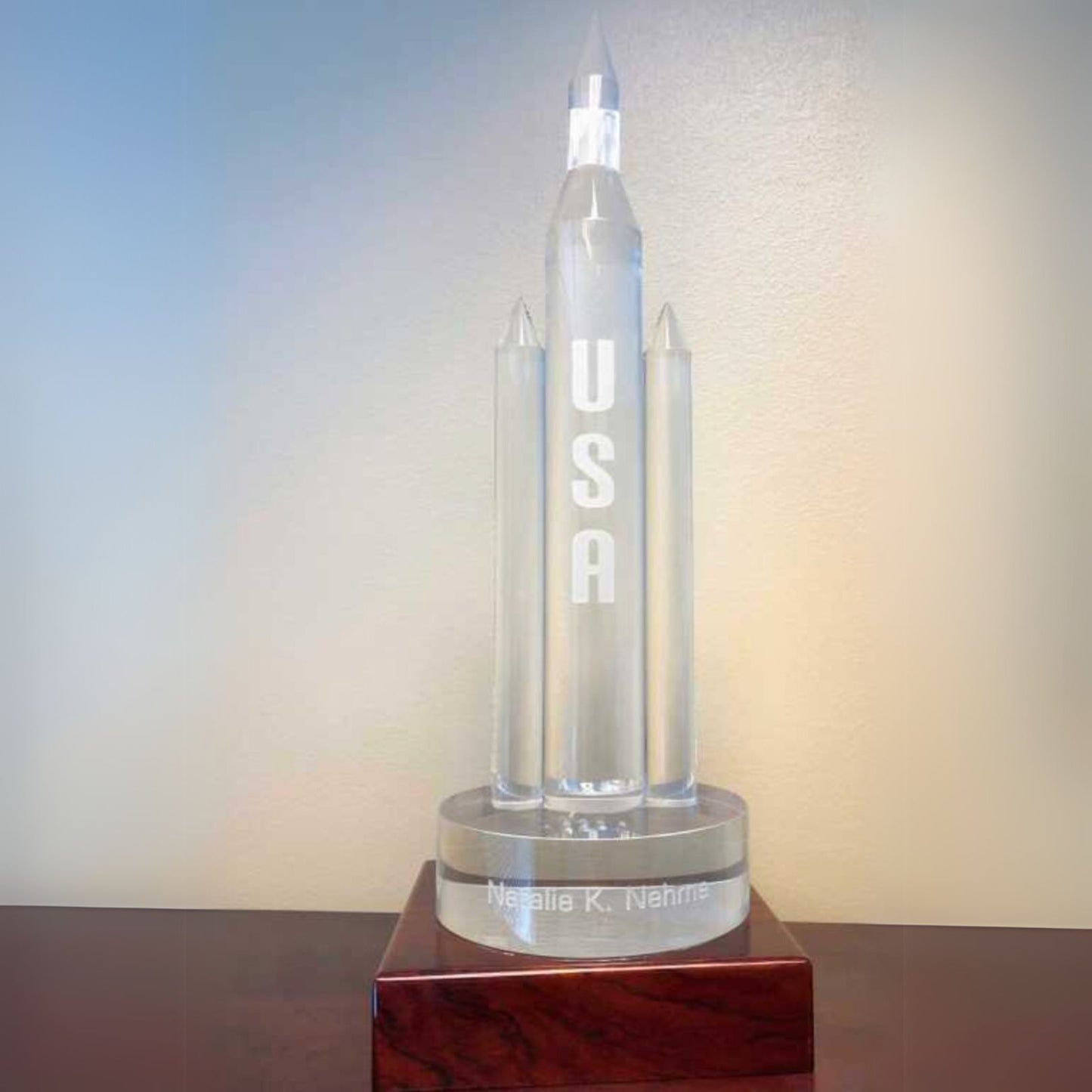 crystal rocket on wooden base