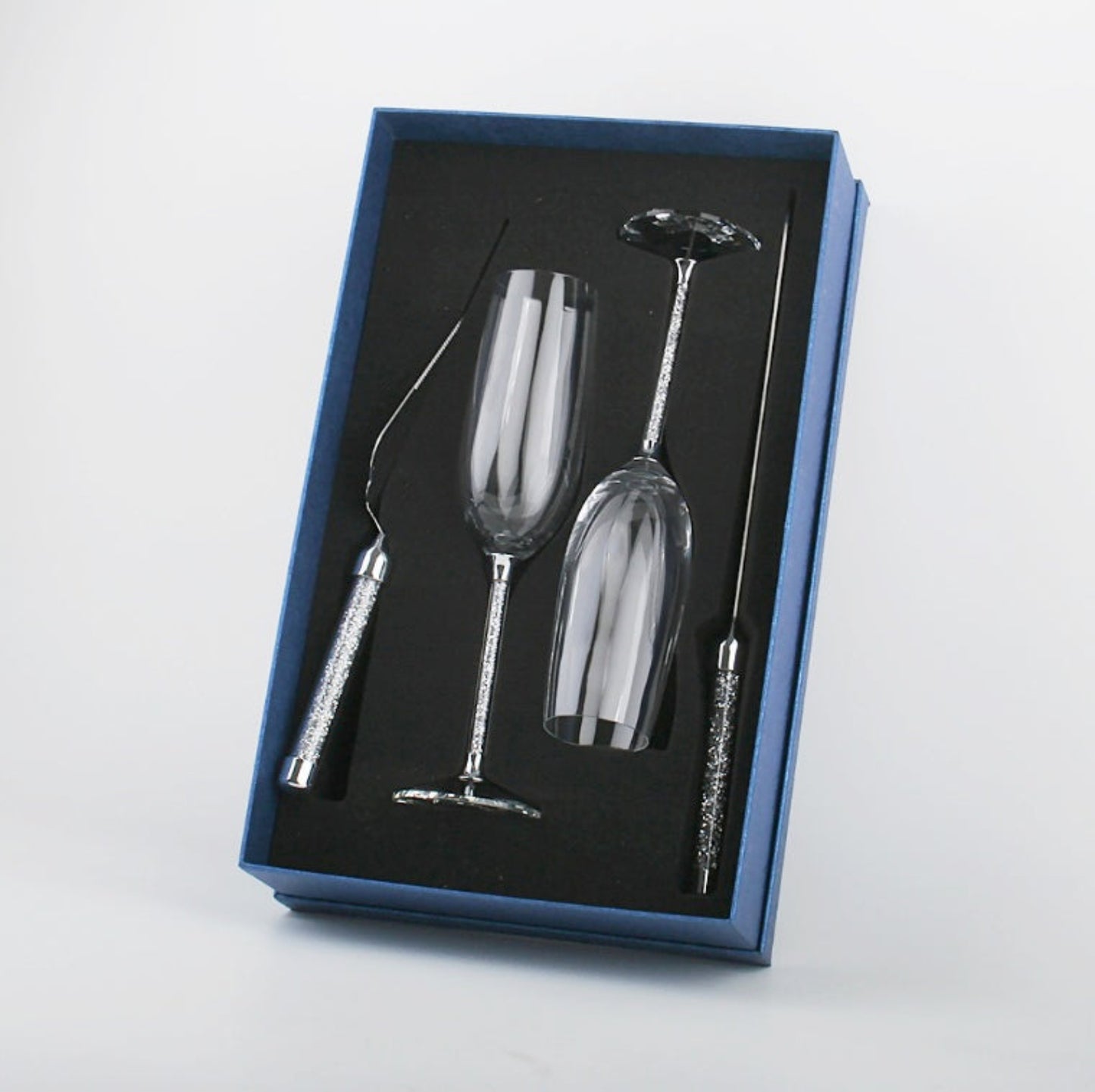 Set of two silver wine glasses with decorative handles in a blue box foam cut