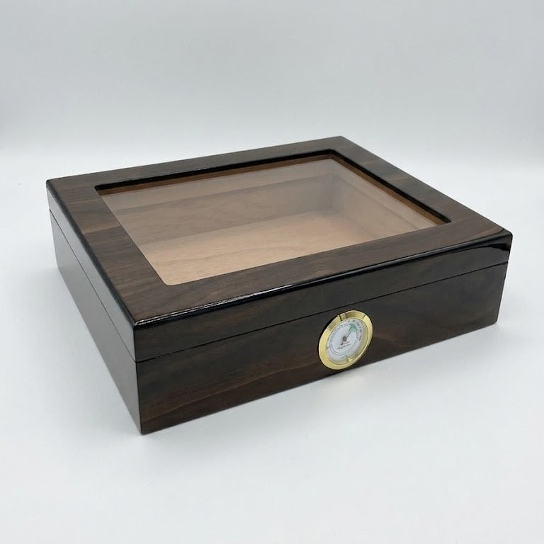 Wooden humidor with glass top on a white background