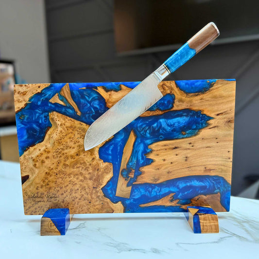 engraved wooden cutting board with artistic blue inlay with knife