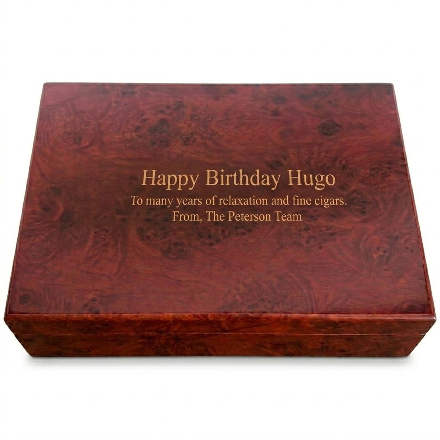Wooden humidor with engraved birthday message on a white background