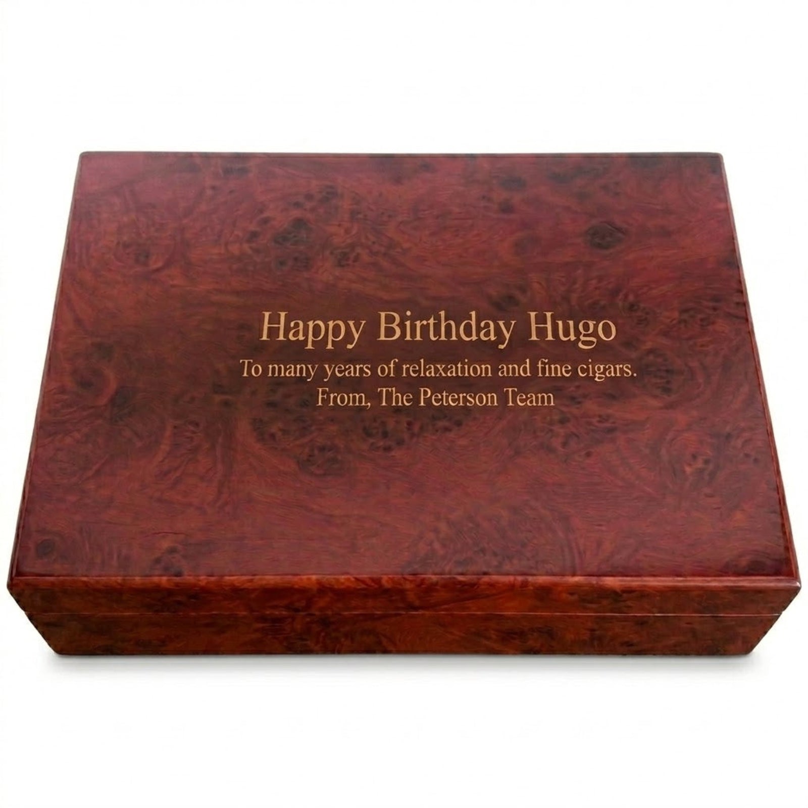 Wooden humidor with engraved birthday message on a white background
