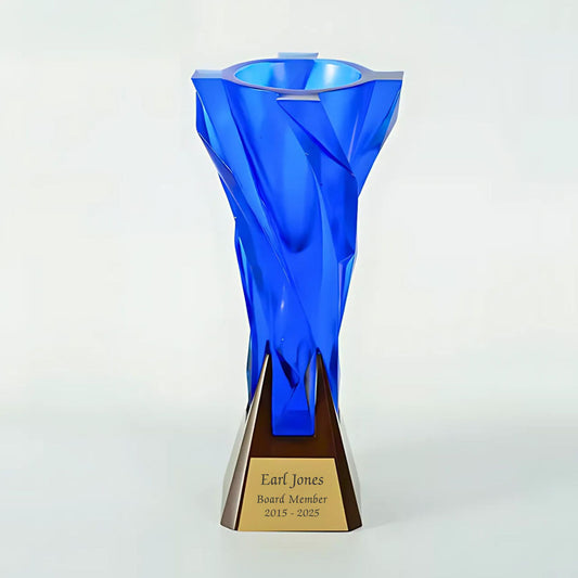 Blue glass trophy with a bronze base on a white background