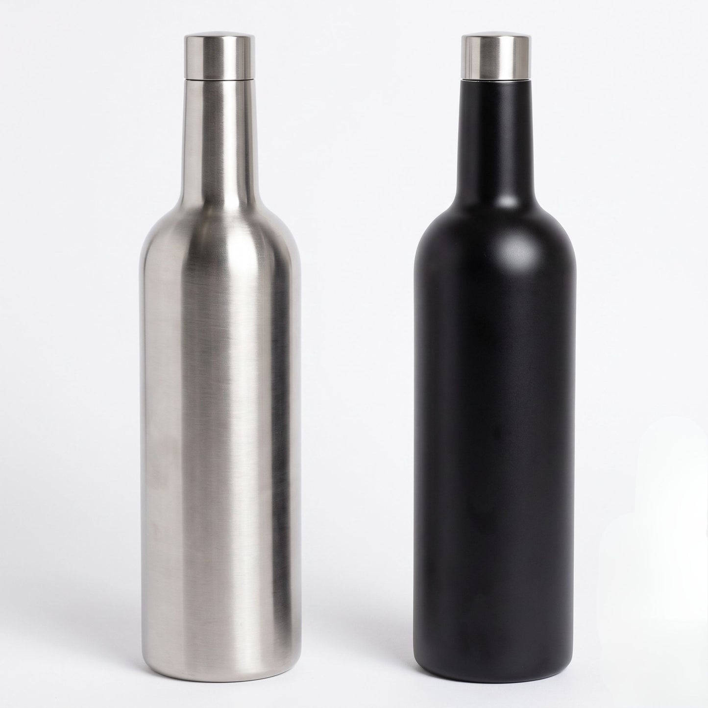  bottle-shaped flasks with narrow necks and silver caps, shown side by side on a light gray background. The left container has a brushed metallic silver finish, and the right container has a matte black finish.