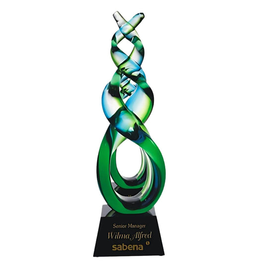 green double helix art glass award on black base
