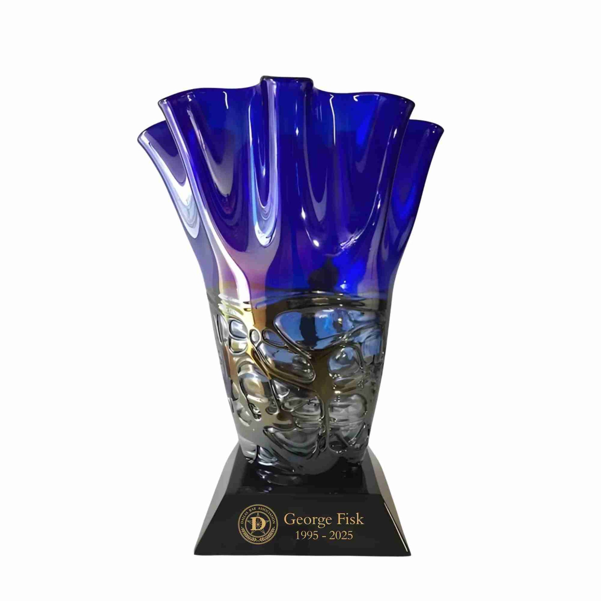 Blue art glass vase on black base with gold fill text
