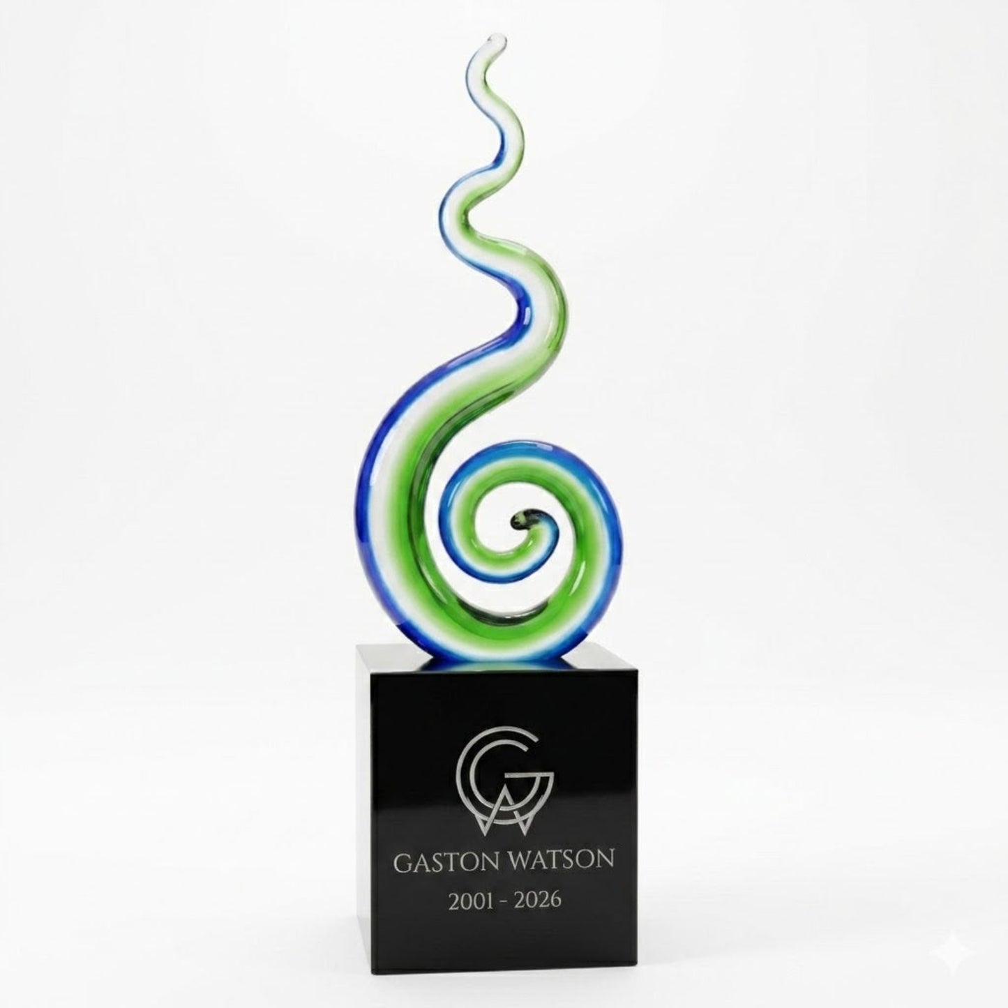 Decorative glass award with a black base featuring 'Gaston Watson' engraving on a white background