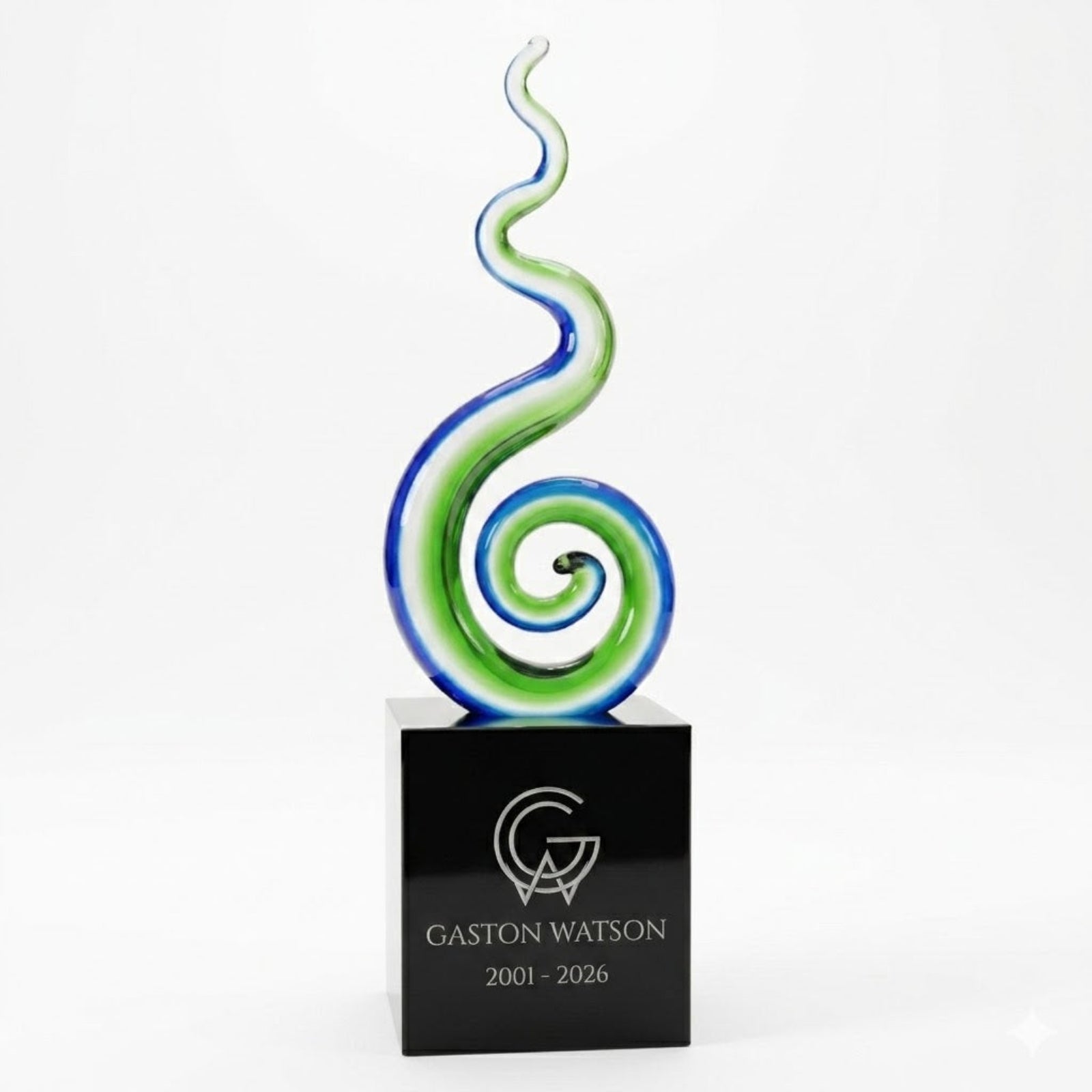 Decorative glass award with a black base featuring 'Gaston Watson' engraving on a white background