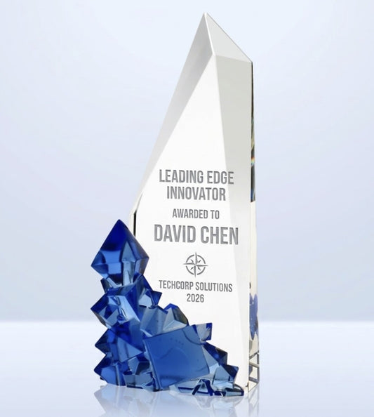 Crystal award with blue crystal base on a light gray background