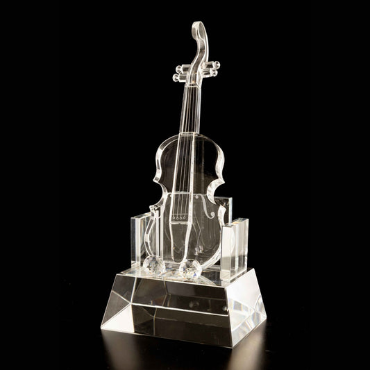 Crystal violin sculpture on a black background