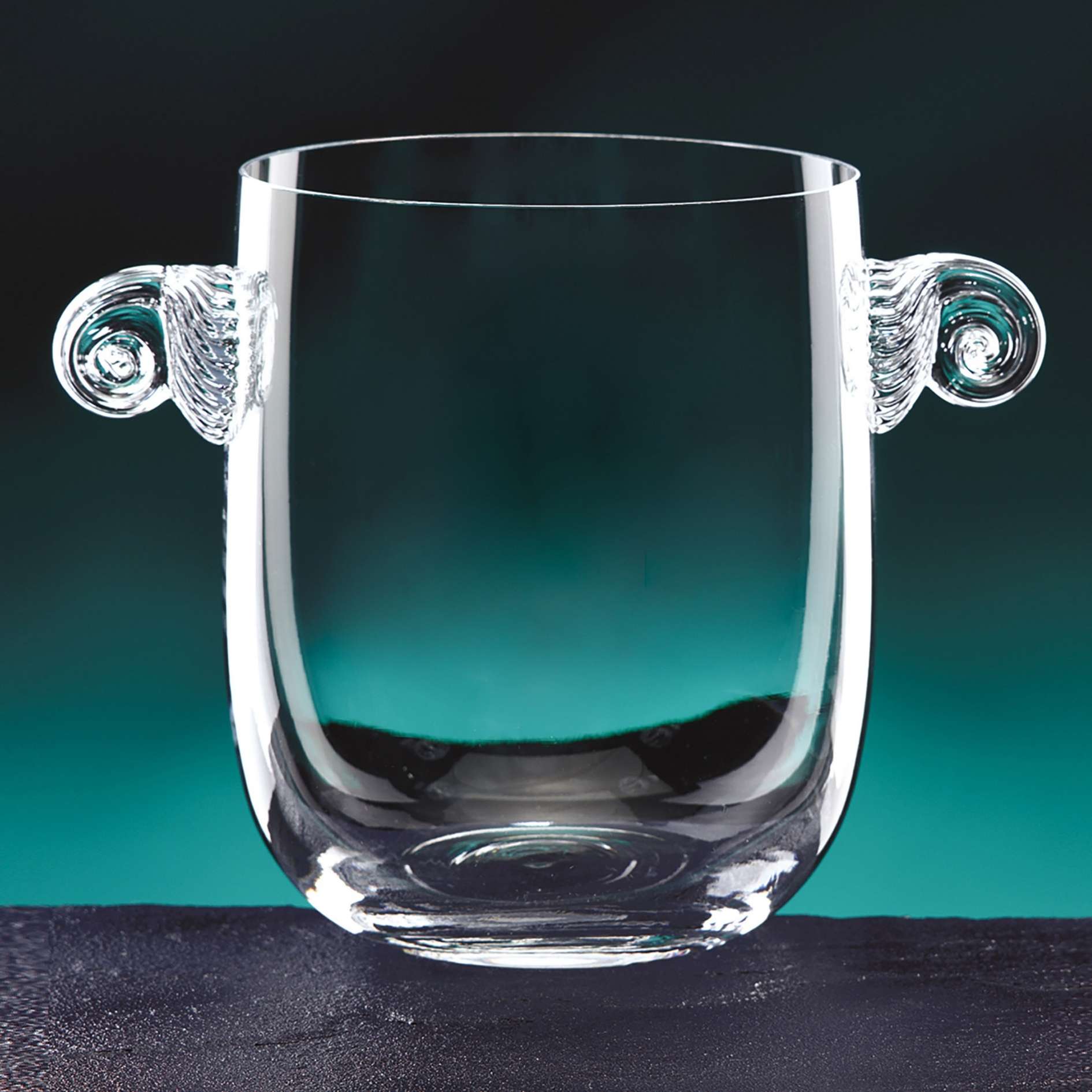 crystal ice bucket with handles on green background