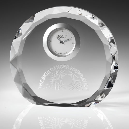 engraved crystal clock on gray background
