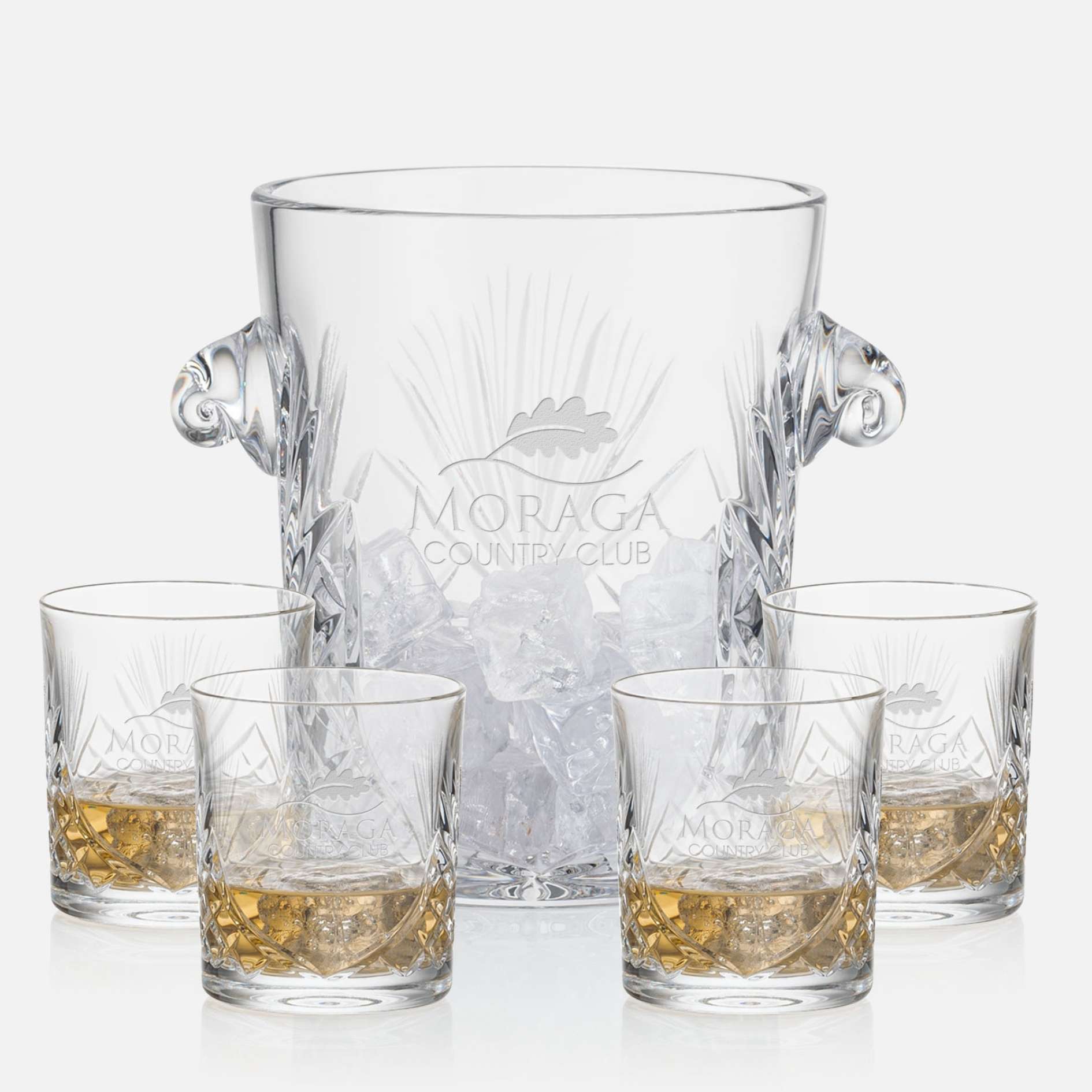cut crystal ice bucket with 4 on the rocks glasses engraved with logo on white background