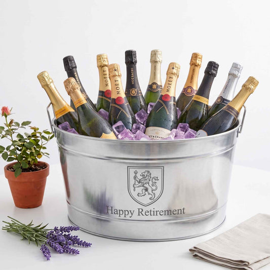 large stainless steel tub engraved happy retirement on white background
