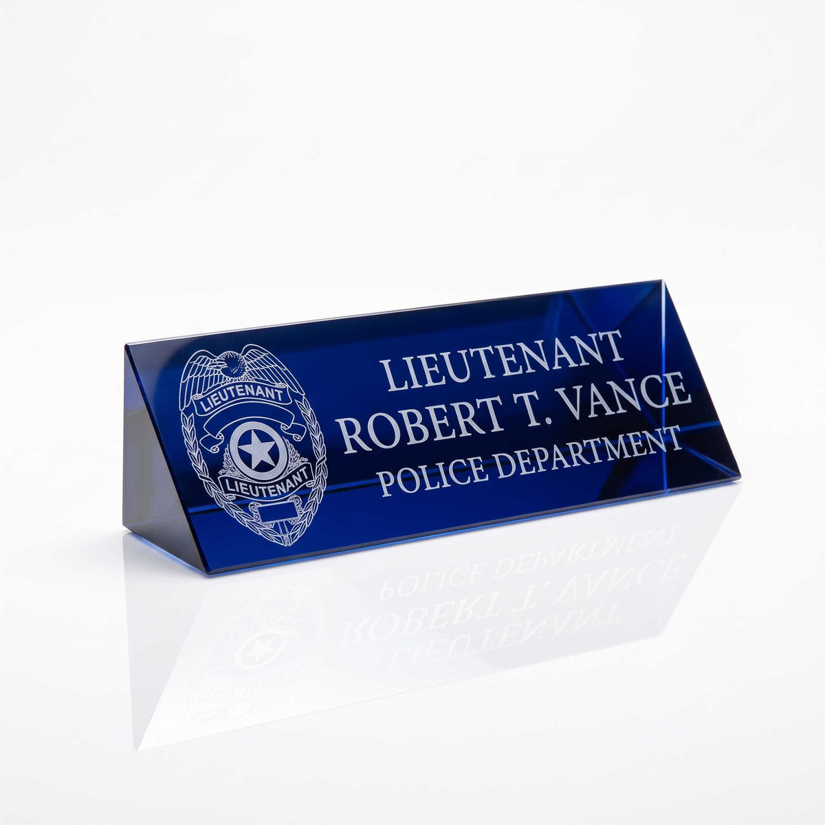 A personalized crystal name plate nameplate featuring a police badge emblem and the text 'LIEUTENANT ROBERT T. VANCE POLICE DEPARTMENT' on a clean white background.