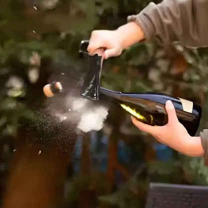 person opening a bottle with sabre